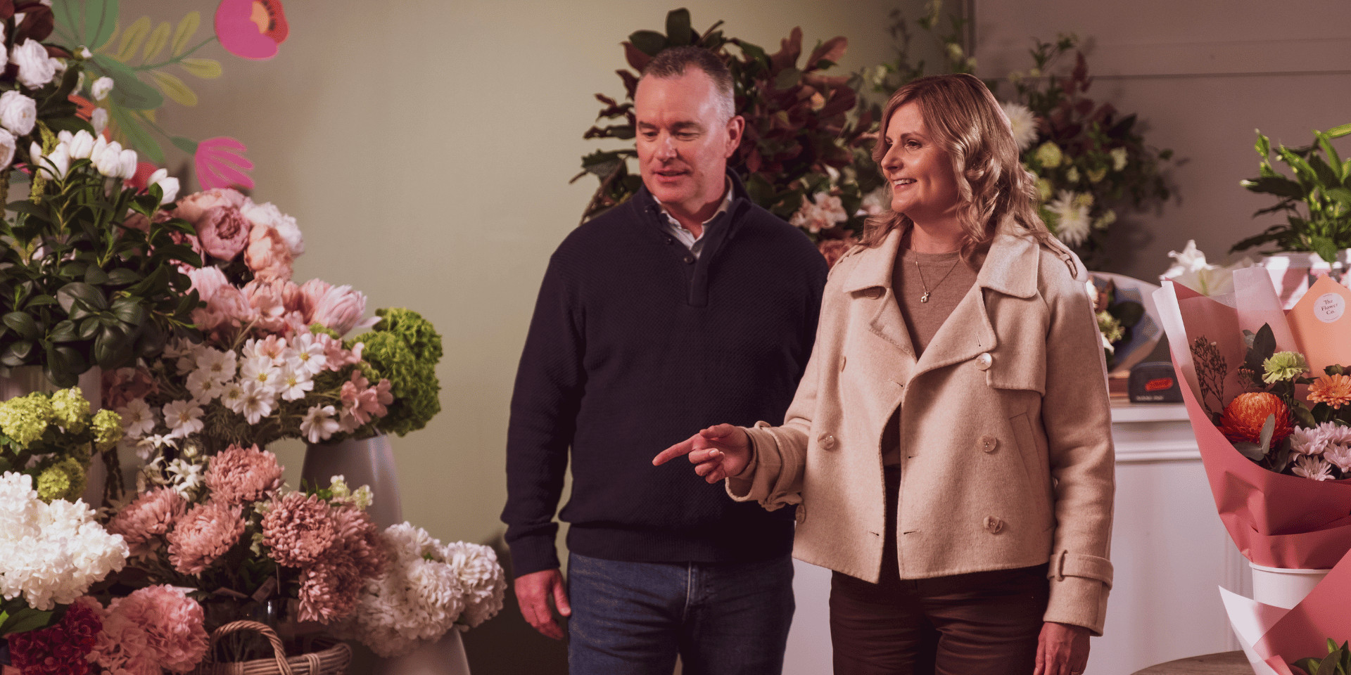 Couple browsing flowers at a florist