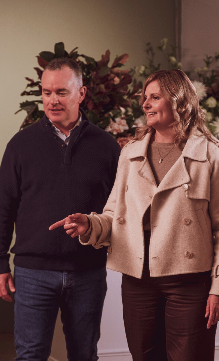 Couple browsing flowers at a florist